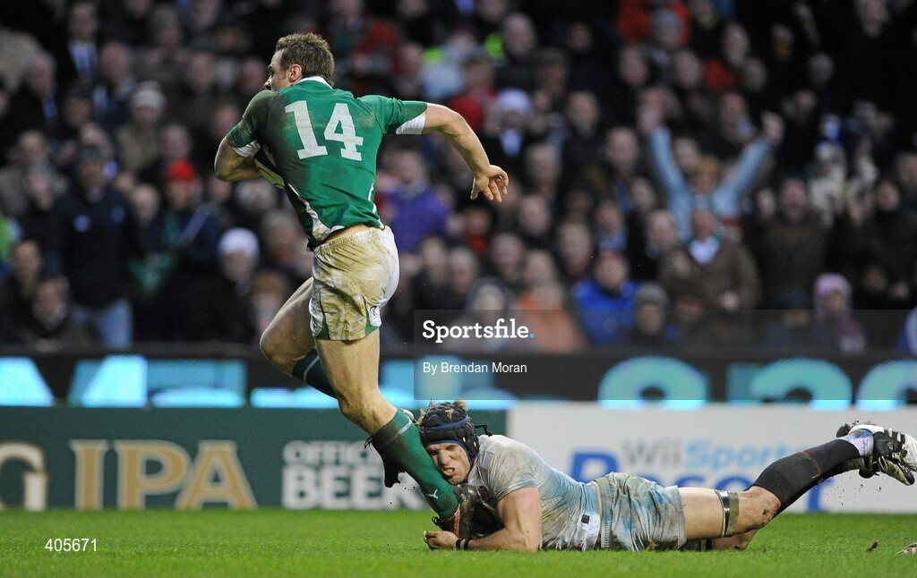 27 February 2010; Tommy Bowe, Ireland, breaks through the tackle of James Haskell, England, on the way to scoring his second and his side's third and winning try. RBS Six Nations Rugby Championship, England v Ireland, Twickenham Stadium, Twickenham, London, England. Picture credit: Brendan Moran / SPORTSFILE