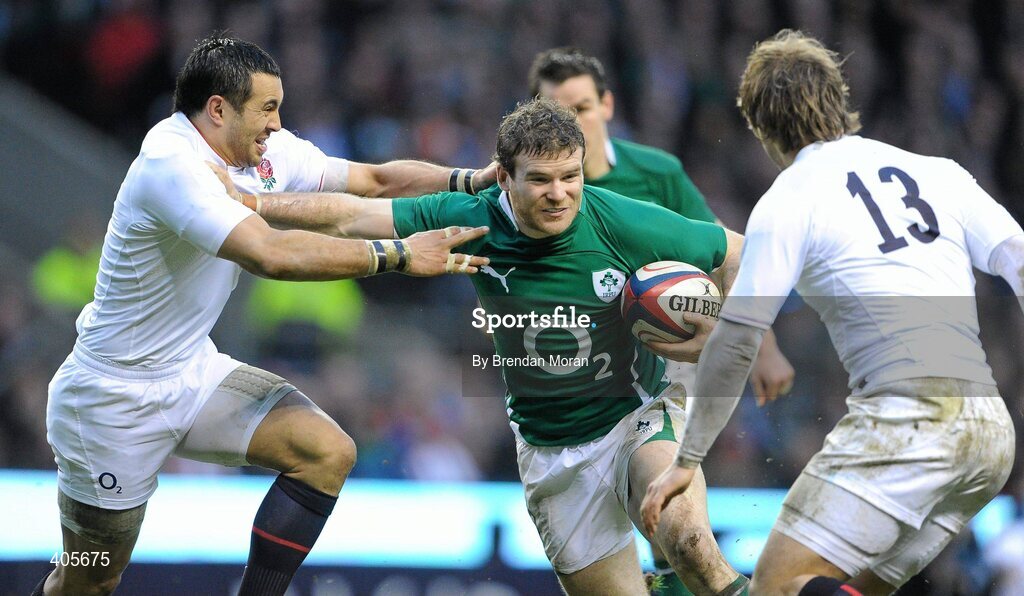 27 February 2010; Gordon D'Arcy, Ireland, holds off the tackle of Riki Flutey, England. RBS Six Nations Rugby Championship, England v Ireland, Twickenham Stadium, Twickenham, London, England. Picture credit: Brendan Moran / SPORTSFILE