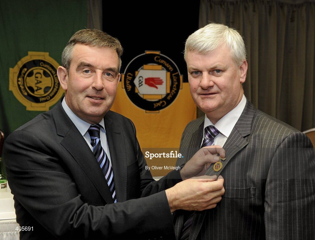 27 February 2010; Outgoing Ulster GAA President Tom Daly, left, hands over the Ulster "O'Neill" Presidential medal to new President Aogan Farrell at the Ulster Council GAA convention. Ulster Council GAA Convention, Errigal Hotel, Cootehill, Co. Cavan. Picture credit: Oliver McVeigh / SPORTSFILE