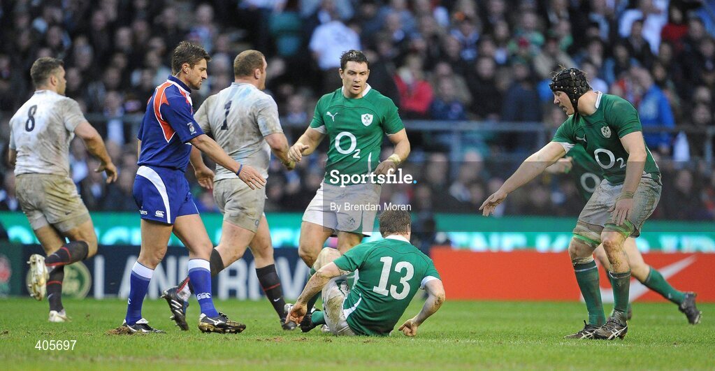 27 February 2010; Ireland captain Brian O'Driscoll falls to the ground during the game as team-mate Stephen Ferris, right, appeals to referee Mark Lawrence to halt the play. RBS Six Nations Rugby Championship, England v Ireland, Twickenham Stadium, Twickenham, London, England. Picture credit: Brendan Moran / SPORTSFILE