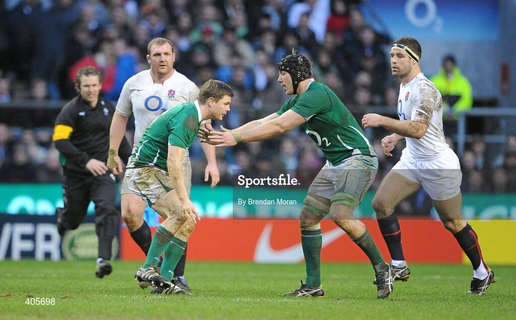 27 February 2010; Ireland captain Brian O'Driscoll is steadied by team-mate Stephen Ferris after falling to the ground for the second time. RBS Six Nations Rugby Championship, England v Ireland, Twickenham Stadium, Twickenham, London, England. Picture credit: Brendan Moran / SPORTSFILE