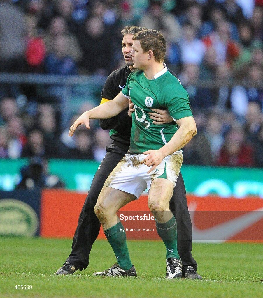 27 February 2010; Ireland captain Brian O'Driscoll is held up by team physio Cameron Steele after falling to the ground twice with suspected concussion during the game. RBS Six Nations Rugby Championship, England v Ireland, Twickenham Stadium, Twickenham, London, England. Picture credit: Brendan Moran / SPORTSFILE