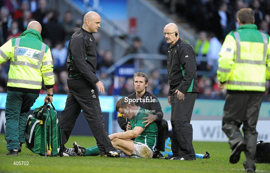 27 February 2010; Ireland captain Brian O'Driscoll is attended to by team medical staff and paramedics before leaving the pitch on a stretcher with suspected concussion. RBS Six Nations Rugby Championship, England v Ireland, Twickenham Stadium, Twickenham, London, England. Picture credit: Brendan Moran / SPORTSFILE
