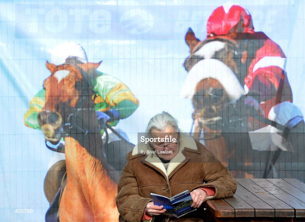 28 February 2010; A race fan studies the form ahead of The www.leopardstown.com Handicap Hurdle. Leopardstown Racecourse, Dublin. Picture credit: Brian Lawless / SPORTSFILE