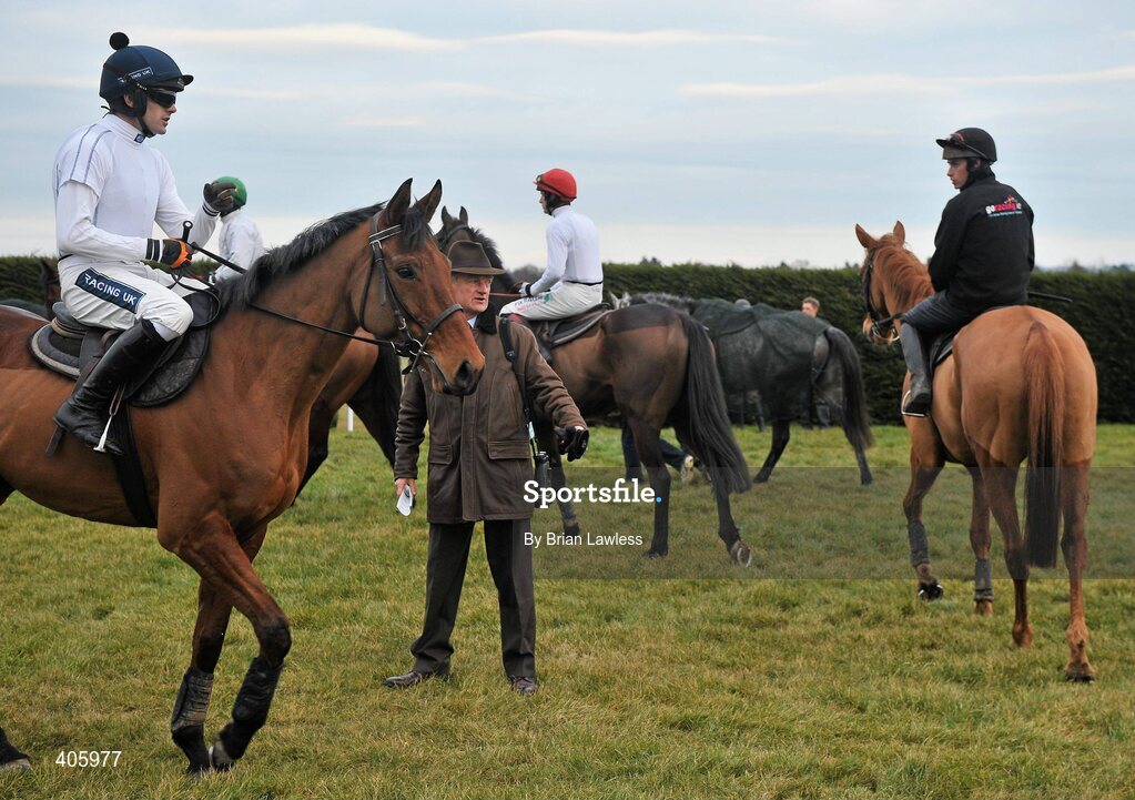 28 February 2010; Trainer Willie Mullins with jockey Ruby Walsh aboard Uimhiraceathair, left, before sending his horses out to the gallops after the days racing. Leopardstown Racecourse, Dublin. Picture credit: Brian Lawless / SPORTSFILE