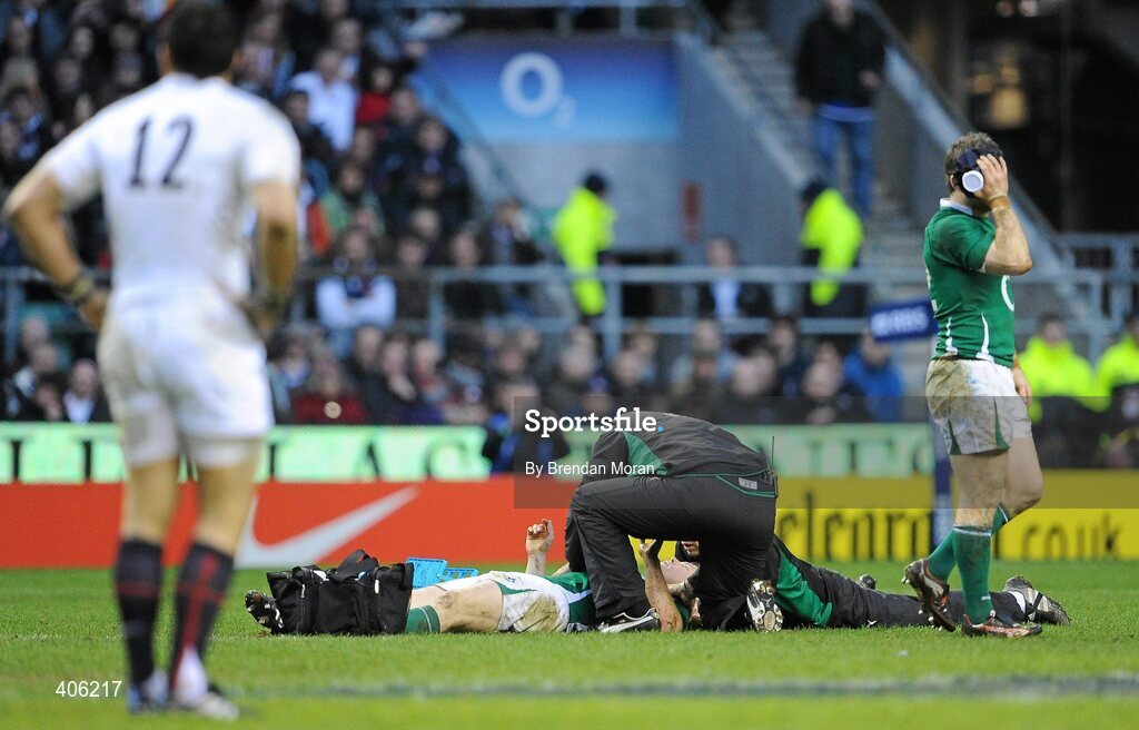 27 February 2010; Ireland captain Brian O'Driscoll is attended to by team doctor Dr. Eanna Falvey and team physio Cameron Steele as team-mate Gordon D'Arcy applies an icebag to a facial injury. RBS Six Nations Rugby Championship, England v Ireland, Twickenham Stadium, Twickenham, London, England. Picture credit: Brendan Moran / SPORTSFILE