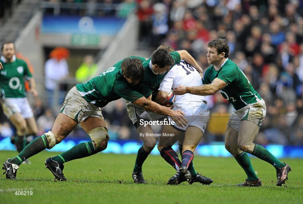 27 February 2010; Ireland players, from left, Donncha O'Callaghan, Jonathan Sexton and Gordon D'Arcy tackle England out-half Jonny Wilkinson. RBS Six Nations Rugby Championship, England v Ireland, Twickenham Stadium, Twickenham, London, England. Picture credit: Brendan Moran / SPORTSFILE