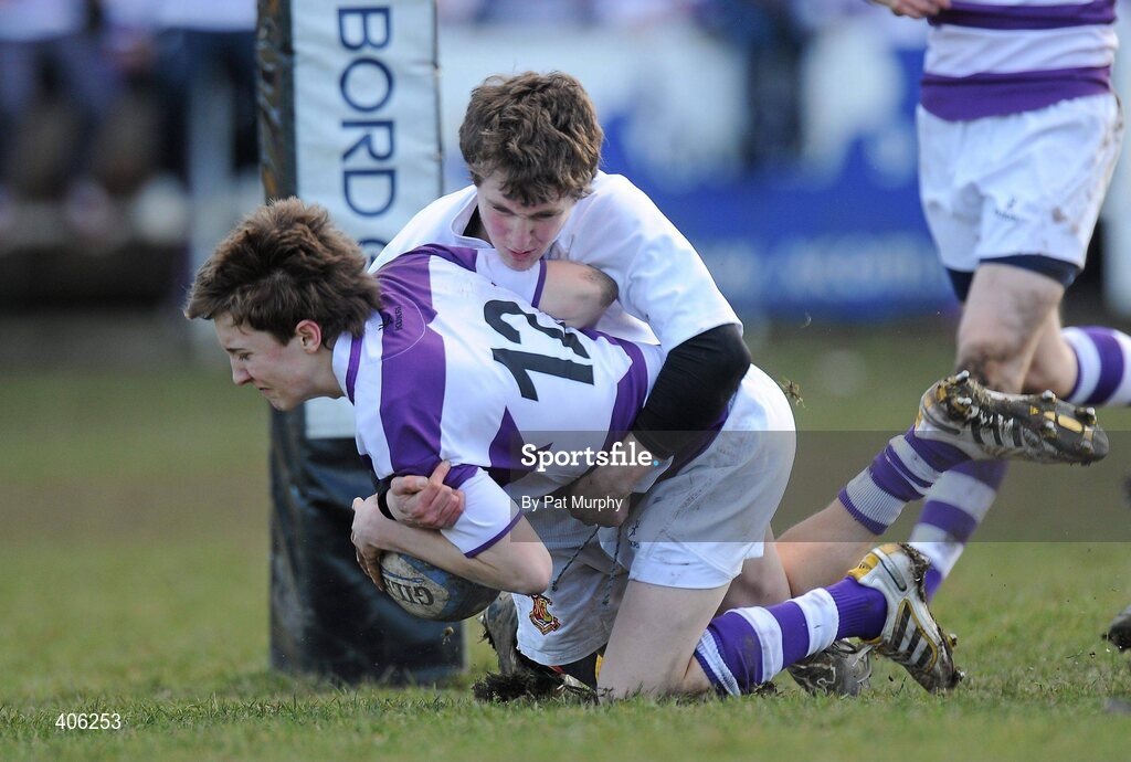 1 March 2010; Daniel O'Sullivan, Clongowes Wood College, scores his side's first try despite the challenge of Diarmuid Cassidy, Presentation College Bray. Leinster Schools Junior Cup Quarter-Final, Presentation College Bray v Clongowes Wood College SJ. Lakelands Park, Terenure, Dublin. Picture credit: Pat Murphy / SPORTSFILE