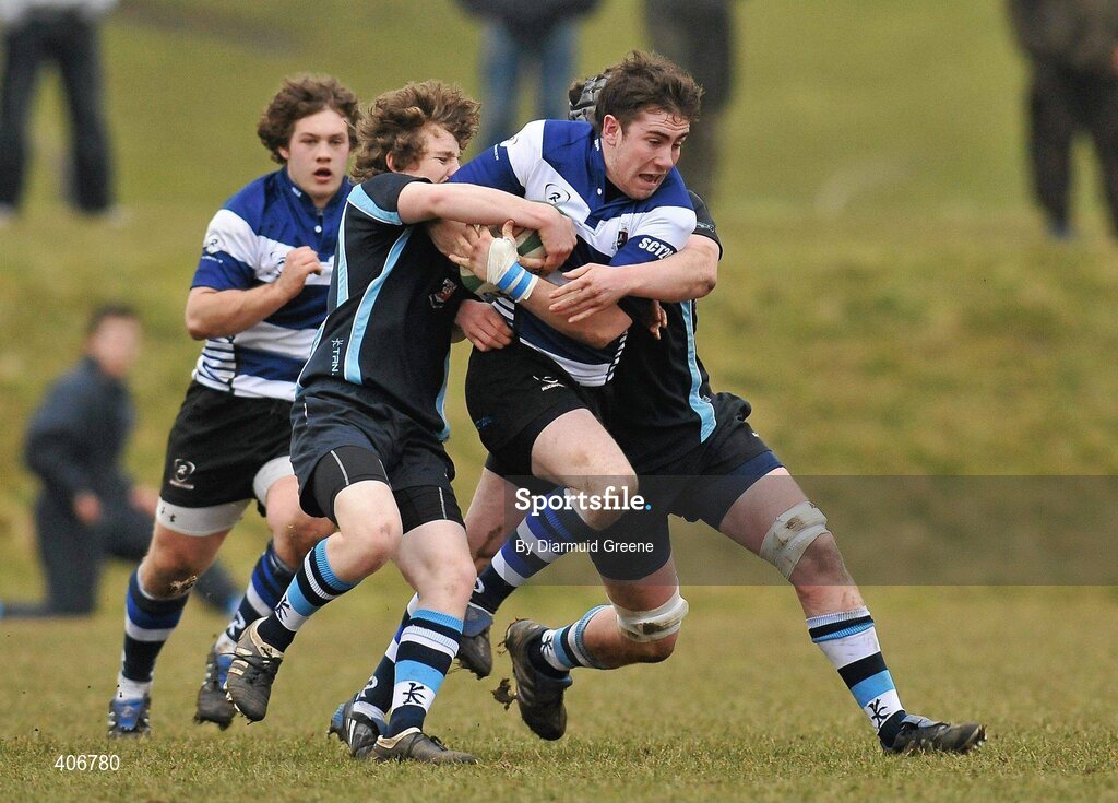 3 March 2010; Tim Rafferty, Rockwell, is tackled by Neil Cronin, left, and Michael O'Dwyer, Castletroy. Avonmore Munster Rugby Schools Senior Cup Semi-Final, Rockwell v Castletroy College, Clanwilliam Park, Tipperary Town, Tipperary. Picture credit: Diarmuid Greene / SPORTSFILE