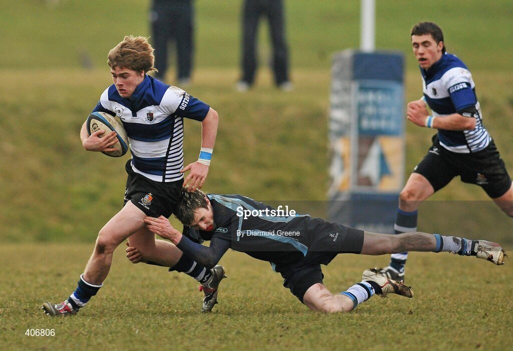 3 March 2010; Donagh McGillycuddy, Rockwell, is tackled by Padraig Quinn, Castletroy. Avonmore Munster Rugby Schools Senior Cup Semi-Final, Rockwell v Castletroy College, Clanwilliam Park, Tipperary Town, Tipperary. Picture credit: Diarmuid Greene / SPORTSFILE