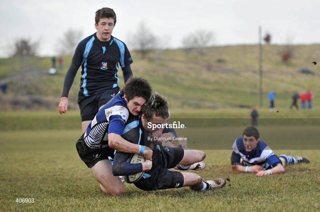 3 March 2010; Padraig Quinn, Castletroy, goes over to score his side's first try late in the game despite the tackle from Tim Rafferty, Rockwell. Avonmore Munster Rugby Schools Senior Cup Semi-Final, Rockwell v Castletroy College, Clanwilliam Park, Tipperary Town, Tipperary. Picture credit: Diarmuid Greene / SPORTSFILE