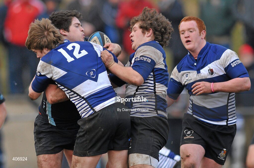 3 March 2010; Enda Carroll, Castletroy, is tackled by Donagh McGillycuddy, Cian O'Donnell, and Tom Doyle, Rockwell. Avonmore Munster Rugby Schools Senior Cup Semi-Final, Rockwell v Castletroy College, Clanwilliam Park, Tipperary Town, Tipperary. Picture credit: Diarmuid Greene / SPORTSFILE