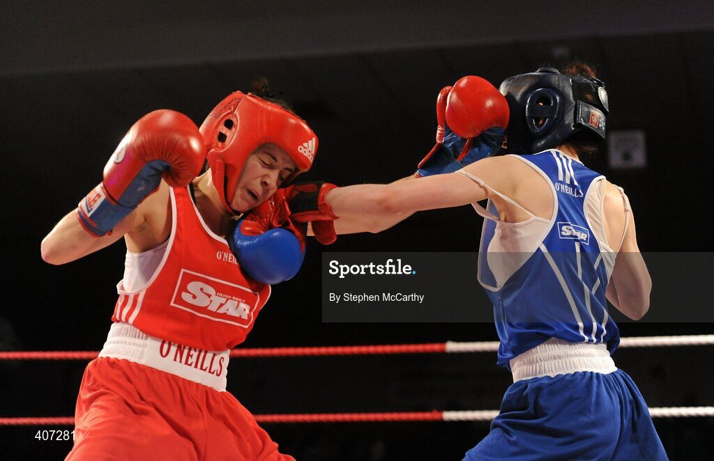 5 March 2010; Jennifer Harte, Four Corners, left, exchanges punches with Catherine O'Grady, Clann Naofa, during their 48kg women's novice bout. National Men's & Women's Elite National Championships 2010 Finals - Friday, National Stadium, Dublin. Picture credit: Stephen McCarthy / SPORTSFILE