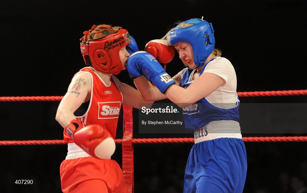 5 March 2010; Debbie Rogers, Bray, left, exchanges punches with Rebecca Meaney, Tolerton, during their women's elite 51kg bout. National Men's & Women's Elite National Championships 2010 Finals - Friday, National Stadium, Dublin. Picture credit: Stephen McCarthy / SPORTSFILE