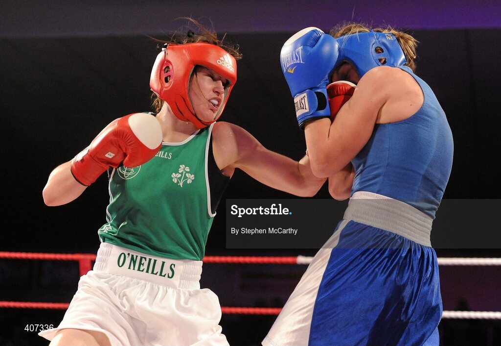 5 March 2010; Katie Taylor, Bray, Ireland, right, exchanges punches with Julia Tsyplakova, Ukraine, during their womens 60kg special bout. National Men's & Women's Elite National Championships 2010 Finals - Friday, National Stadium, Dublin. Picture credit: Stephen McCarthy / SPORTSFILE