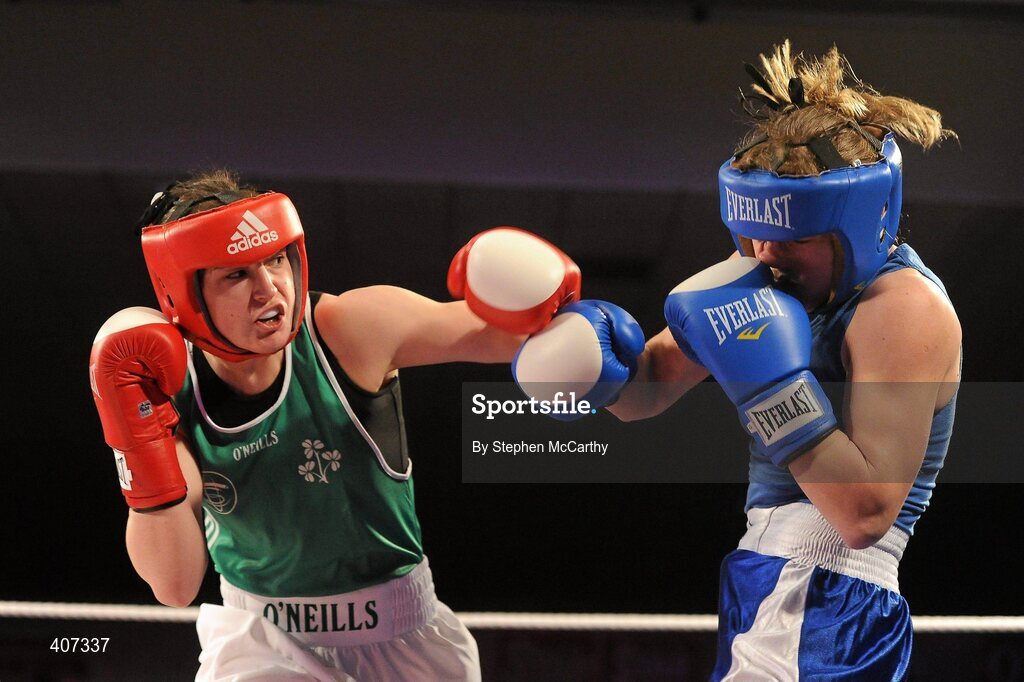 5 March 2010; Katie Taylor, Bray, Ireland, left, exchanges punches with Julia Tsyplakova, Ukraine, during their womens 60kg special bout. National Men's & Women's Elite National Championships 2010 Finals - Friday, National Stadium, Dublin. Picture credit: Stephen McCarthy / SPORTSFILE