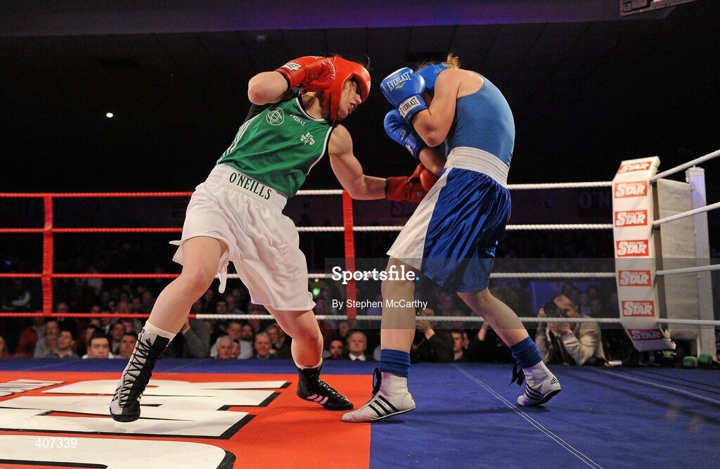 5 March 2010; Katie Taylor, Bray, Ireland, left, exchanges punches with Julia Tsyplakova, Ukraine, during their womens 60kg special bout. National Men's & Women's Elite National Championships 2010 Finals - Friday, National Stadium, Dublin. Picture credit: Stephen McCarthy / SPORTSFILE