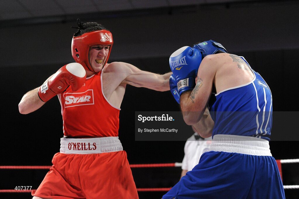 5 March 2010; Willie McLoughlin, Illies Golden Gloves, left, exchanges punches with John Joe Joyce, St Michaels Athy, during their 69kg bout. National Men's & Women's Elite National Championships 2010 Finals - Friday, National Stadium, Dublin. Picture credit: Stephen McCarthy / SPORTSFILE