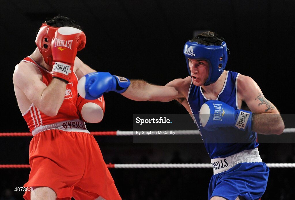 5 March 2010; John Joe Joyce, St Michaels Athy, right, exchanges punches with Willie McLoughlin, Illies Golden Gloves, during their 69kg bout. National Men's & Women's Elite National Championships 2010 Finals - Friday, National Stadium, Dublin. Picture credit: Stephen McCarthy / SPORTSFILE