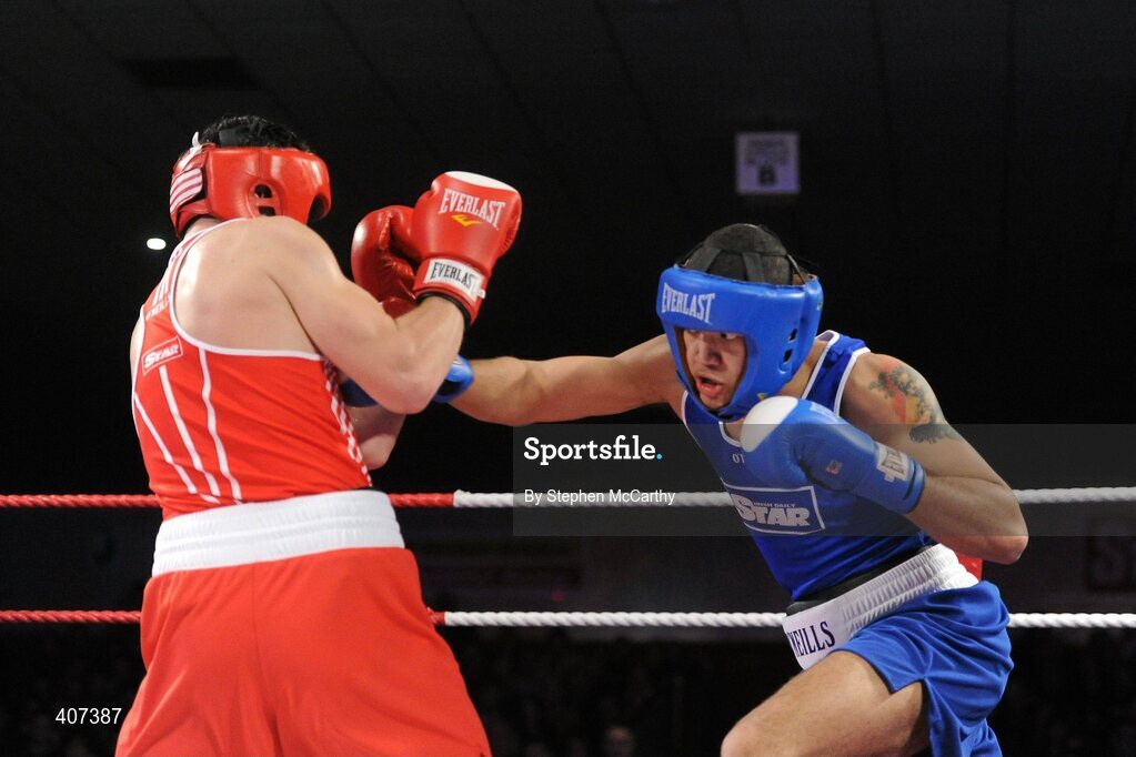 5 March 2010; Kenny Egan, Neilstown, left, exchanges punches with Tommy McCarthy, Oliver Plunketts, during their 81kg bout. National Men's & Women's Elite National Championships 2010 Finals - Friday, National Stadium, Dublin. Picture credit: Stephen McCarthy / SPORTSFILE