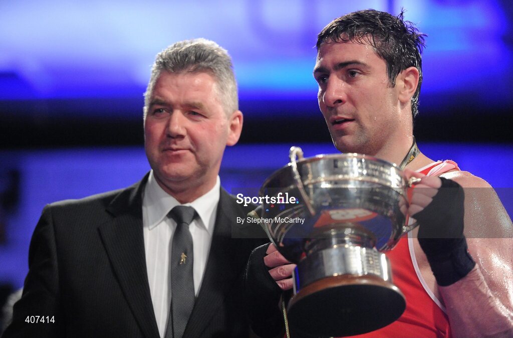 5 March 2010; Kenny Egan, Neilstown, receives his elite 81kg final trophy from former national champion boxer Jim O'Sullivan following his victory over Tommy McCarthy, Oliver Plunketts. Egan matches Jim O'Sullivan's run of ten non-consecutive senior title wins between 1980 and 1990. National Men's & Women's Elite National Championships 2010 Finals - Friday, National Stadium, Dublin. Picture credit: Stephen McCarthy / SPORTSFILE