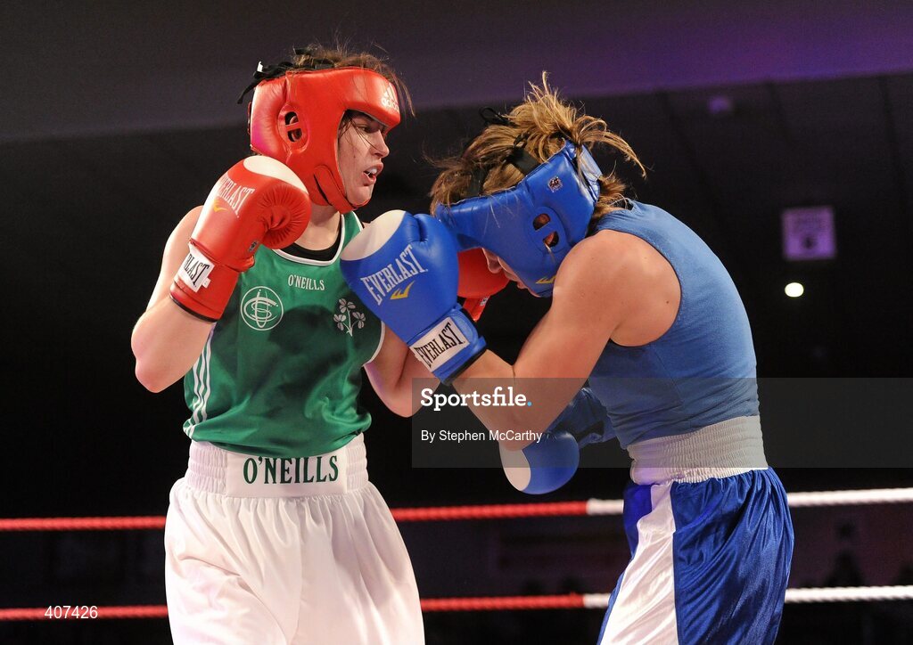 5 March 2010; Katie Taylor, Bray, Ireland, left, exchanges punches with Julia Tsyplakova, Ukraine, during their womens 60kg special bout. National Men's & Women's Elite National Championships 2010 Finals - Friday, National Stadium, Dublin. Picture credit: Stephen McCarthy / SPORTSFILE