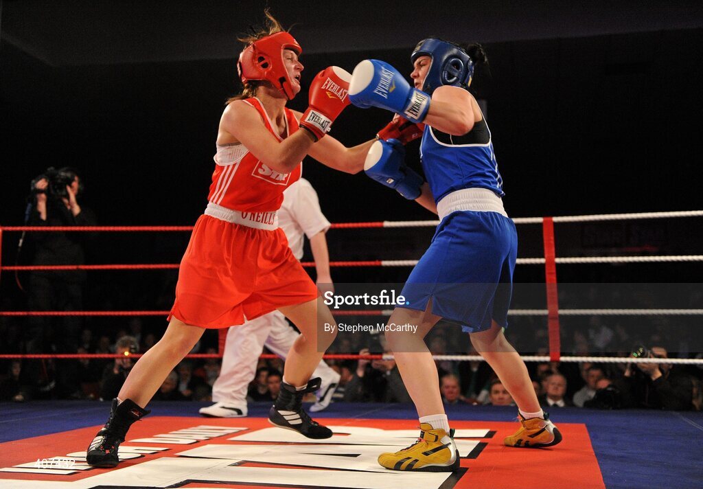 5 March 2010; Kelly Harrington, West Finglas, right, and Jessica Lyons, St Francis, Limerick, exchange punches during their elite women's 69kg final bout. National Men's & Women's Elite National Championships 2010 Finals - Friday, National Stadium, Dublin. Picture credit: Stephen McCarthy / SPORTSFILE