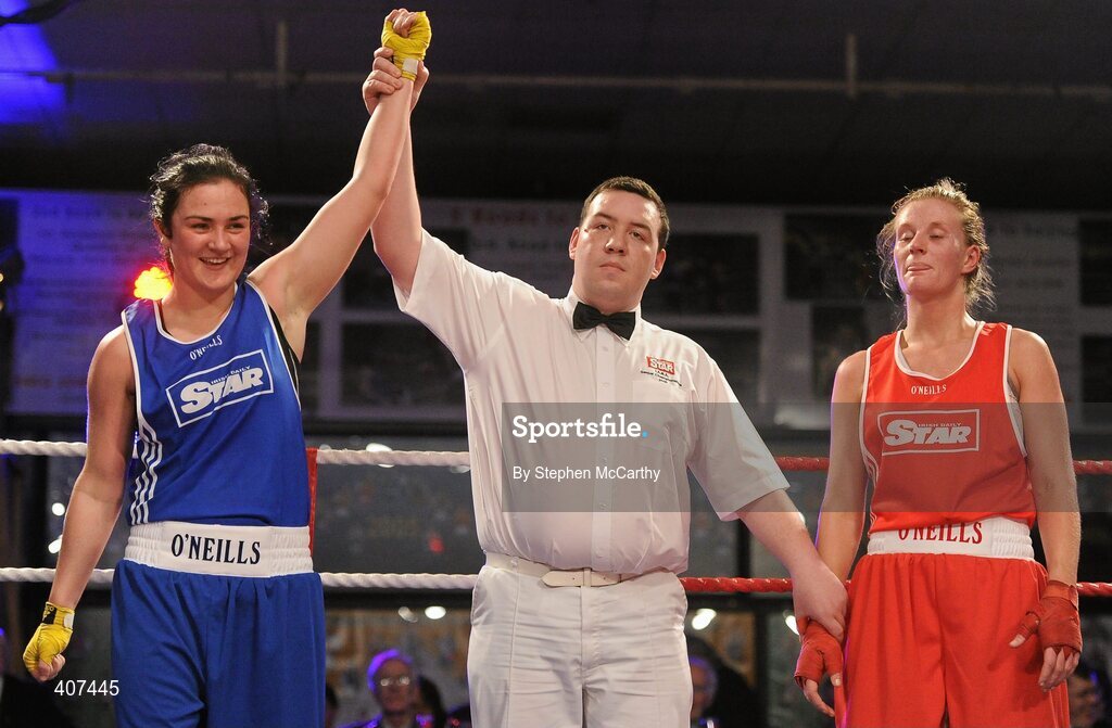 5 March 2010; Kelly Harrington, West Finglas, is announced victorious over Jessica Lyons, St Francis, Limerick, by referee James McCarron following their elite women's 69kg final bout. National Men's & Women's Elite National Championships 2010 Finals - Friday, National Stadium, Dublin. Picture credit: Stephen McCarthy / SPORTSFILE