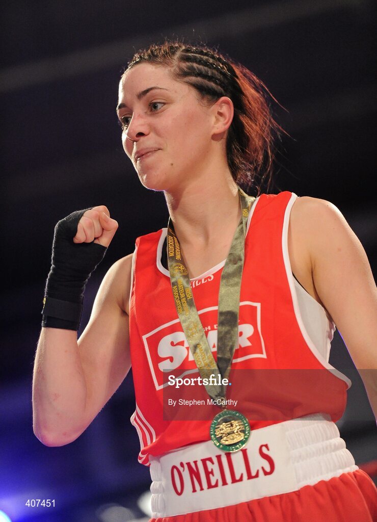 5 March 2010; Jennifer Harte, Four Corners, celebrates her 48kg women's novice final victory over Catherine O'Grady, Clann Naofa, after the referee stopped the contest in the thrid and final round. National Men's & Women's Elite National Championships 2010 Finals - Friday, National Stadium, Dublin. Picture credit: Stephen McCarthy / SPORTSFILE