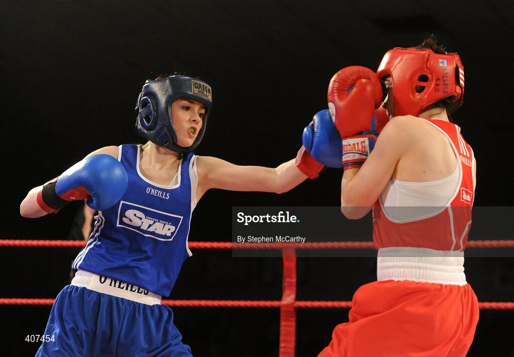 5 March 2010; Jennifer Harte, Four Corners, right, exchanges punches with Catherine O'Grady, Clann Naofa, during their 48kg women's novice final bout. National Men's & Women's Elite National Championships 2010 Finals - Friday, National Stadium, Dublin. Picture credit: Stephen McCarthy / SPORTSFILE