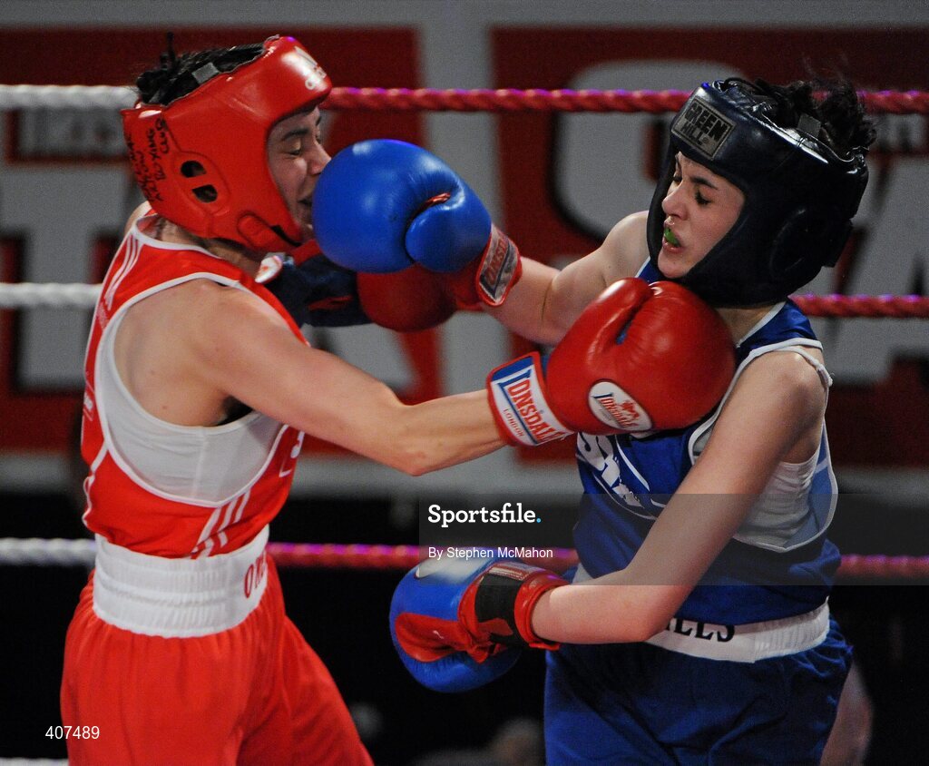 5 March 2010; Jennifer Harte, Four Corners, left, exchanges punches with Catherine O'Grady, Clann Naofa, during their 48kg women's novice final bout. National Men's & Women's Elite National Championships 2010 Finals - Friday, National Stadium, Dublin. Picture credit: Stephen McMahon / SPORTSFILE