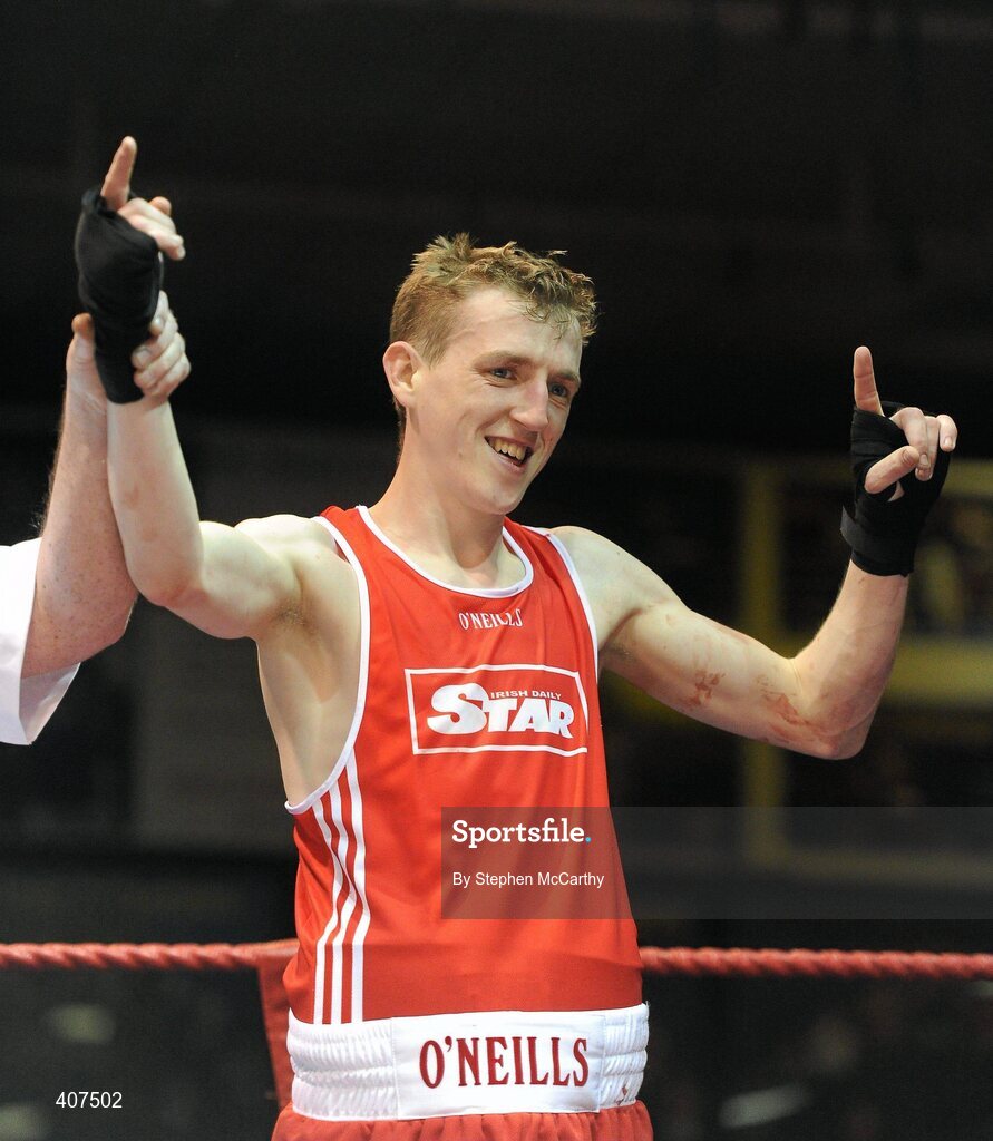 6 March 2010; Michael Hawkins, Holy Trinity, is victorious over Chris Smith, Canal, following their men's novice 54kg final. Men's Novice National Championships 2010 Finals - Saturday Afternoon Session, National Stadium, Dublin. Picture credit: Stephen McCarthy / SPORTSFILE