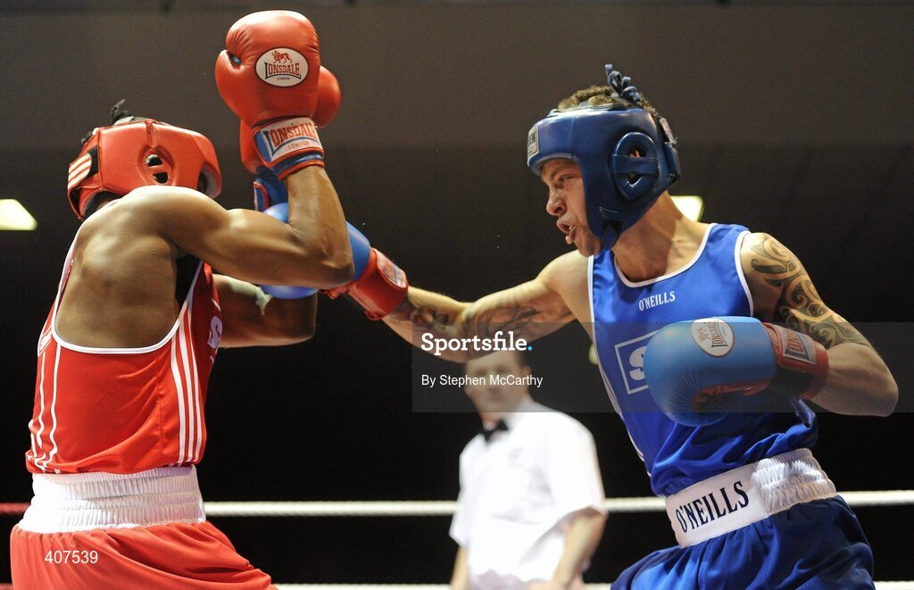 6 March 2010; Karl Kinga, Mount Tallant, defends a left of Conal Hall, Clonard, during their men's novice 67kg bout. Men's Novice National Championships 2010 Finals - Saturday Afternoon Session, National Stadium, Dublin. Picture credit: Stephen McCarthy / SPORTSFILE