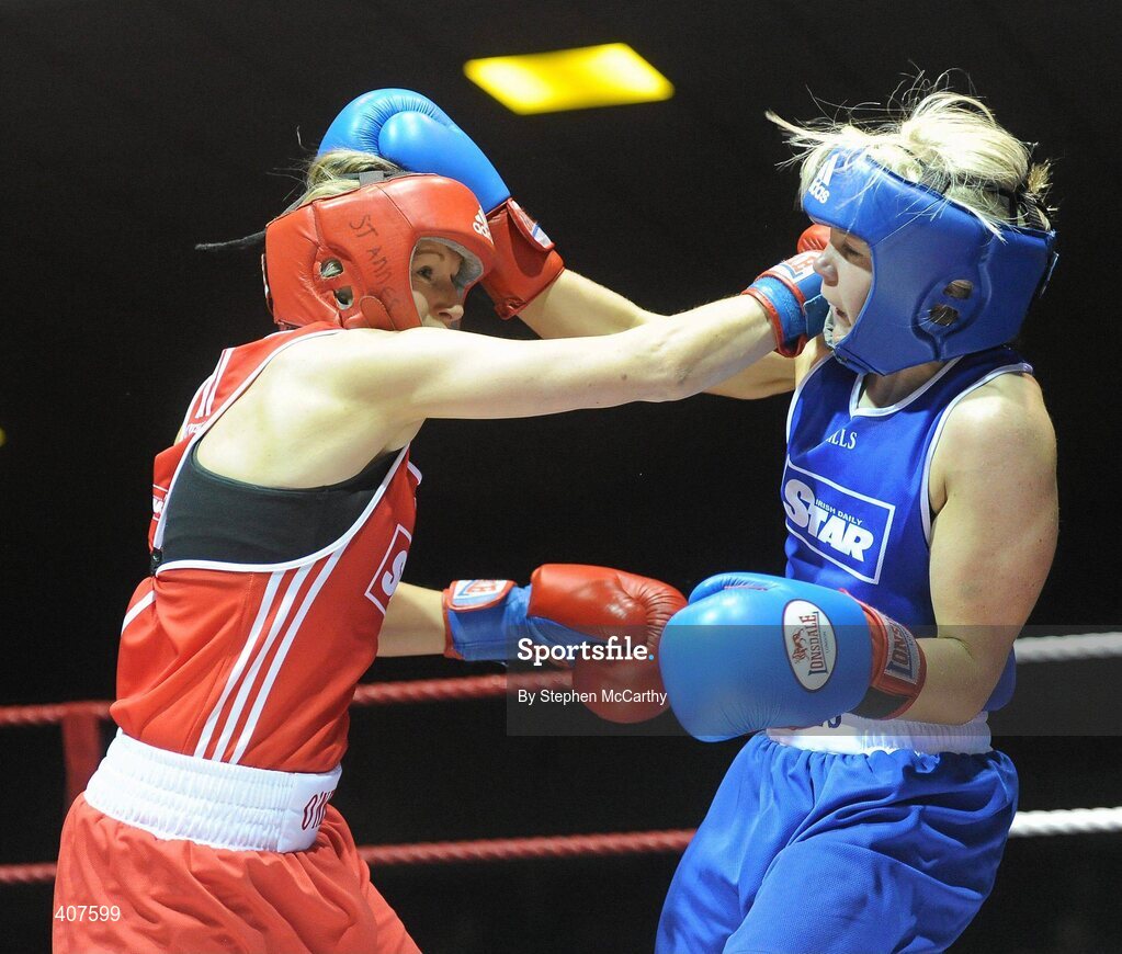6 March 2010; Sharon McGing, St Annes Westport, left, exchanges punches with Amanda Loughlin, Bray, during their women's novice 54kg bout. Men's Elite & Women's Novice National Championships 2010 Finals - Saturday Evening Session, National Stadium, Dublin. Picture credit: Stephen McCarthy / SPORTSFILE