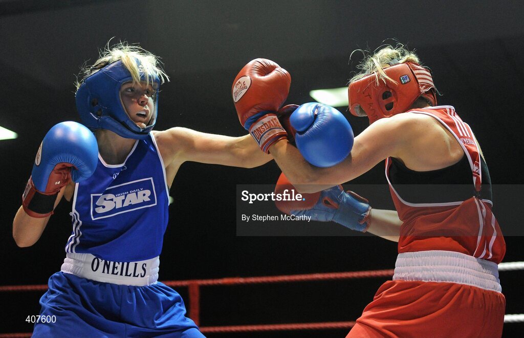 6 March 2010; Sharon McGing, St Annes Westport, right, exchanges punches with Amanda Loughlin, Bray, during their women's novice 54kg bout. Men's Elite & Women's Novice National Championships 2010 Finals - Saturday Evening Session, National Stadium, Dublin. Picture credit: Stephen McCarthy / SPORTSFILE