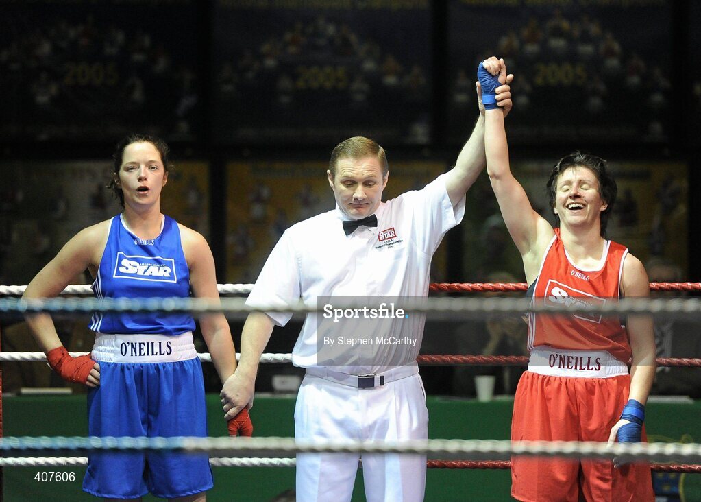 6 March 2010; Sabrina Hughes, Ryston, is announced victorious over Mairead Keane, Ballinacarrow, by referee Paul McMahon following their women's novice 60kg. Men's Elite & Women's Novice National Championships 2010 Finals - Saturday Evening Session, National Stadium, Dublin. Picture credit: Stephen McCarthy / SPORTSFILE
