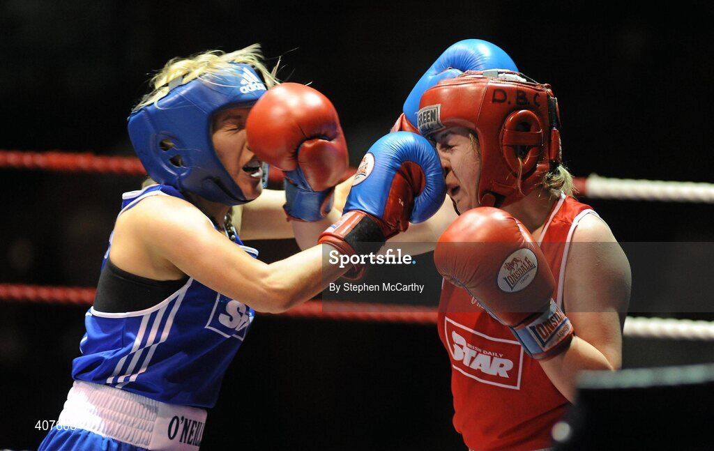 6 March 2010; Frances Rock, Baldoyle, left, exchanges punches with Noreen Crawford, Dungarvan, during their women's novice 63kg final bout. Men's Elite & Women's Novice National Championships 2010 Finals - Saturday Evening Session, National Stadium, Dublin. Picture credit: Stephen McCarthy / SPORTSFILE