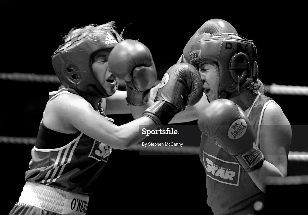 6 March 2010; Frances Rock, Baldoyle, left, exchanges punches with Noreen Crawford, Dungarvan, during their women's novice 63kg final bout. Men's Elite & Women's Novice National Championships 2010 Finals - Saturday Evening Session, National Stadium, Dublin. Picture credit: Stephen McCarthy / SPORTSFILE
