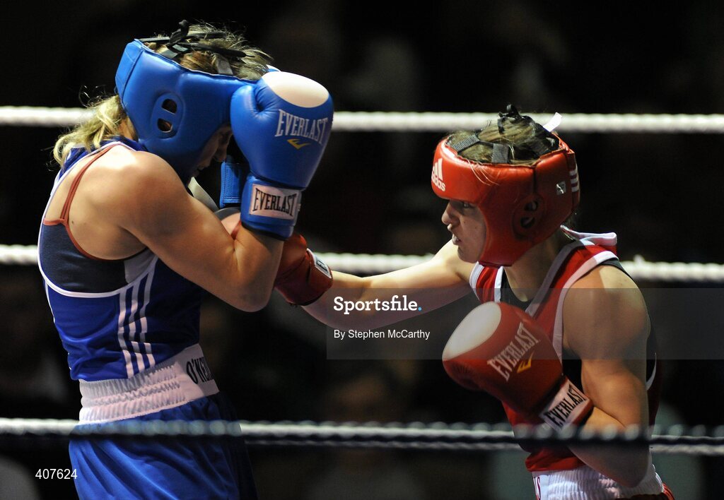 6 March 2010; Katie Taylor, Bray, Ireland, right, exchanges punches with Julia Tsyplakova, Ukraine, during their women's 60kg special bout. Men's Elite & Women's Novice National Championships 2010 Finals - Saturday Evening Session, National Stadium, Dublin. Picture credit: Stephen McCarthy / SPORTSFILE