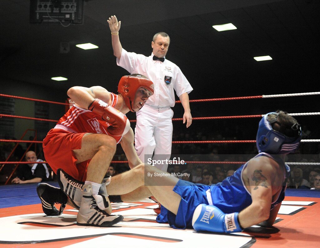 6 March 2010; John Joe Nevin, Cavan, left, and Derek Thorpe, St Aidans, fall to the canvas during their men's elite 54kg final bout. Men's Elite & Women's Novice National Championships 2010 Finals - Saturday Evening Session, National Stadium, Dublin. Picture credit: Stephen McCarthy / SPORTSFILE