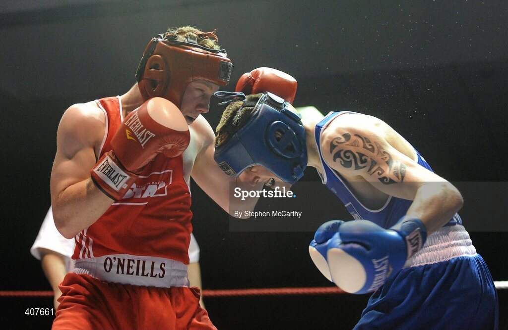 6 March 2010; Ray Moylette, St Annes Westport, left, exchanges punches with Stephen Donnelly, All Saints, during their men's elite 64kg bout. Men's Elite & Women's Novice National Championships 2010 Finals - Saturday Evening Session, National Stadium, Dublin. Picture credit: Stephen McCarthy / SPORTSFILE