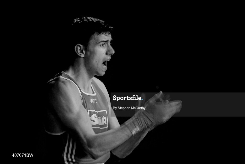 6 March 2010; Edward O’Connor, Sacred Heart Dublin, following his men's novice 71kg final bout with Colm Nolan, Bray urges on club-mate Paul Farrell, Sacred Heart Dublin, during his men's novice 75kg final bout with Julio Carvalio, Monkstown Antrim. Men's Novice National Championships 2010 Finals - Saturday Afternoon Session, National Stadium, Dublin. Picture credit: Stephen McCarthy / SPORTSFILE