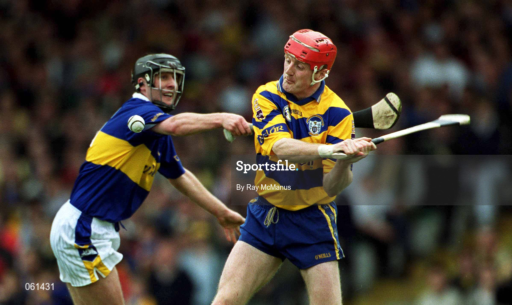 6 May 2001; Brian Lohan of Clare in action against Eddie Enright of Tipperary during the Allianz National Hurling League Final match between Tipperary and Clare at the Gaelic Grounds in Limerick. Photo by Ray McManus/Sportsfile