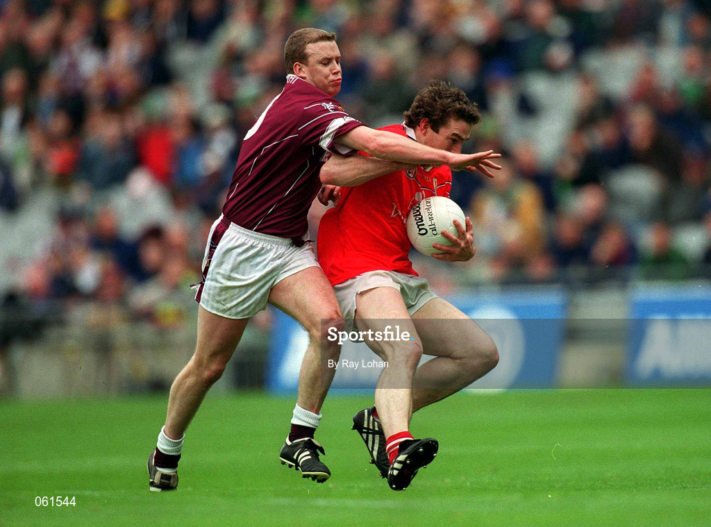 29 April 2001; Eoin Sexton of Cork is tackled by Damien Healy of Westmeath during the Allianz GAA National Football League Division 2 Final match between Westmeath and Cork at Croke Park in Dublin. Photo by Ray Lohan/Sportsfile