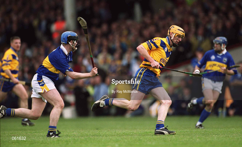 6 May 2001; Niall Gilligan of Clare races clear of Thomas Costello of Tipperary during the Allianz National Hurling League Final match between Tipperary and Clare at the Gaelic Grounds in Limerick. Photo by Ray McManus/Sportsfile