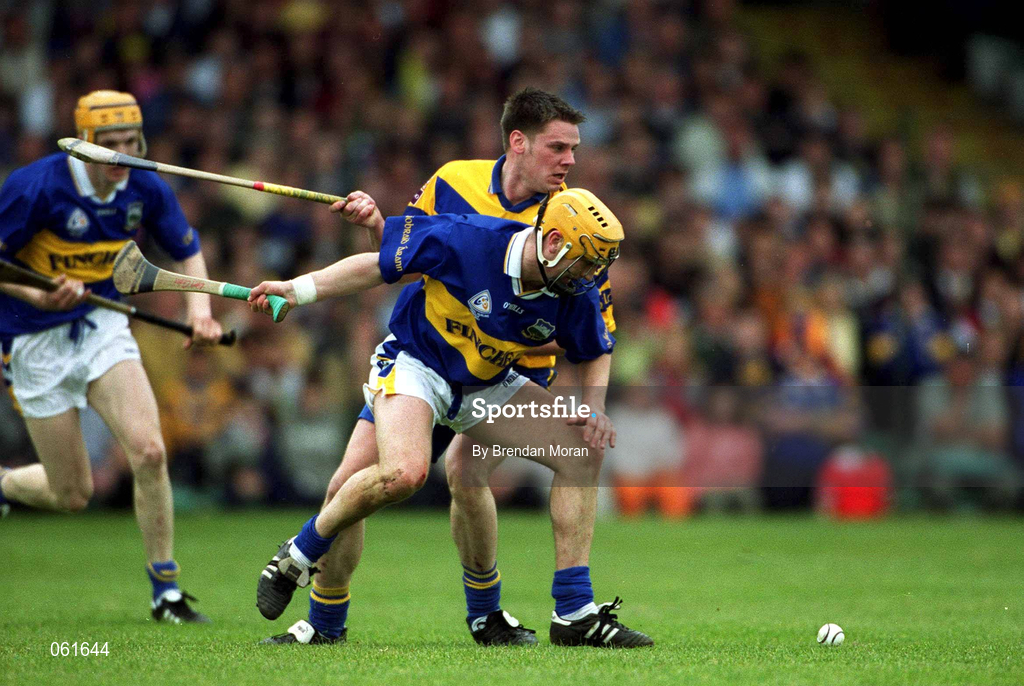 6 May 2001; Liam Cahill of Tipperary, supported by team-mate Lar Corbett, behind, attempts to get possession ahead of John Reddan of Clare during the Allianz National Hurling League Final match between Tipperary and Clare at the Gaelic Grounds in Limerick. Photo by Brendan Moran/Sportsfile