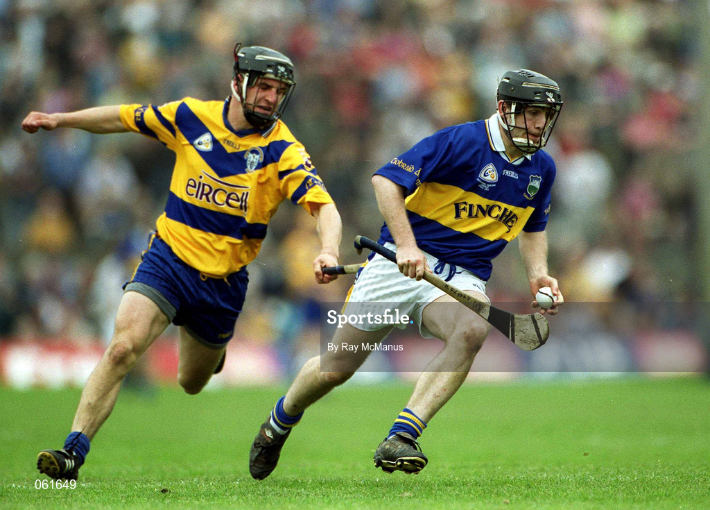 6 May 2001; Mark O'Leary of Tipperary races clear of Gerry Quinn of Clare during the Allianz National Hurling League Final match between Tipperary and Clare at the Gaelic Grounds in Limerick. Photo by Ray McManus/Sportsfile