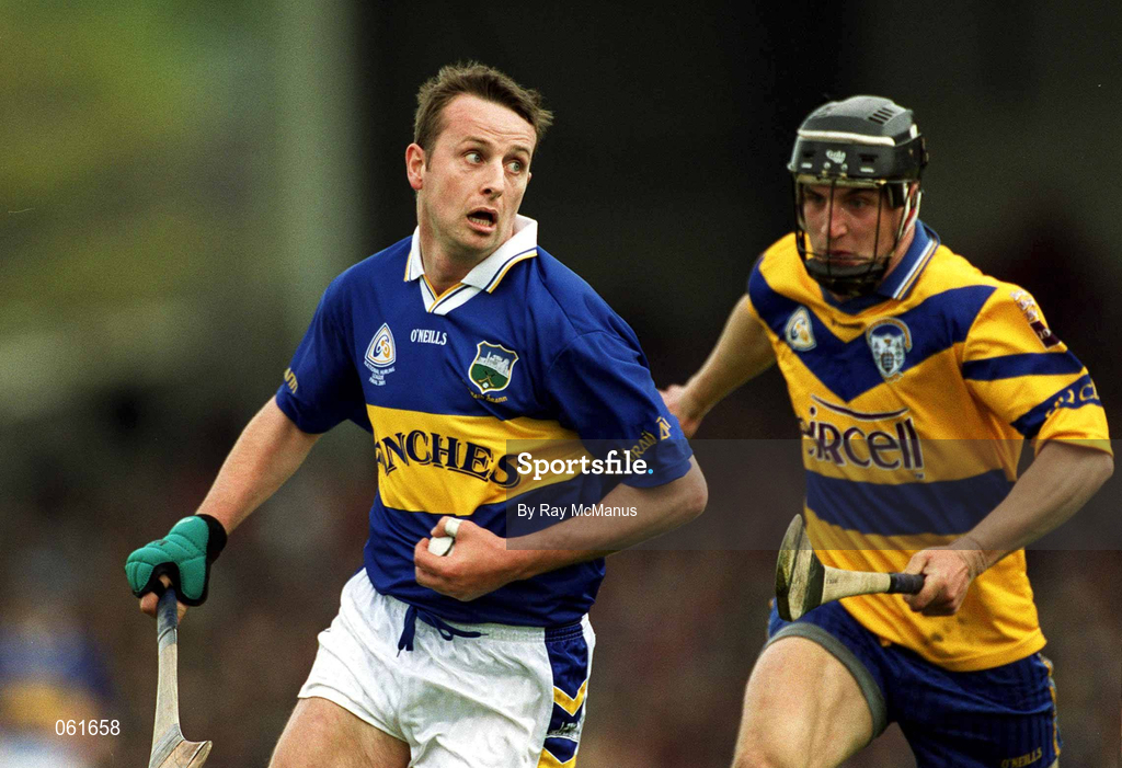 6 May 2001; Brian O'Meara of Tipperary races clear of Gerry Quinn of Clare during the Allianz National Hurling League Final match between Tipperary and Clare at the Gaelic Grounds in Limerick. Photo by Ray McManus/Sportsfile