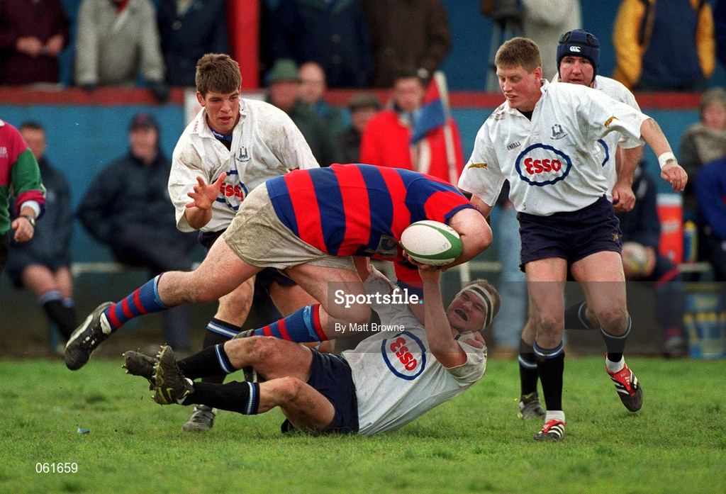29 April 2001; Dave Moore of Clontarf is tackled by Cork Constitution players, from left, Donncha O'Callaghan, Jerry Murray and Ronan O'Gara during the AIB All-Ireland League Rugby Division 1 match between Clontarf and Cork Constitution at Castle Avenue in Dublin. Photo by Matt Browne/Sportsfile