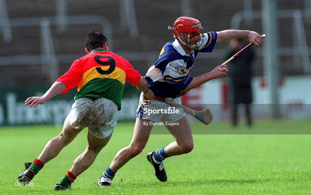 29 April 2001; Fionan O'Sullivan of Laois in action against Johnny Nevin of Carlow during the Guinness Leinster Senior Hurling Championship Preliminary Round match between Carlow and Laois at Dr Cullen Park in Carlow. Photo by Damien Eagers/Sportsfile